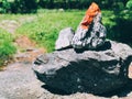 A pile of stones cairn marker on iron trail