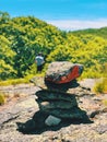 A pile of stones cairn marker on iron trail