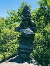 A pile of stones cairn marker on iron trail