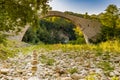 Pile of stones and hog-backed bridge