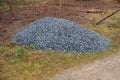 A pile of stones in a landfill for use on a construction site or in garden architecture for mulching, walls and gabions. Fine grav Royalty Free Stock Photo