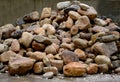 Pile of stones in a landfill for use on a construction site or in garden architecture for mulching, walls and gabions. Fine gravel Royalty Free Stock Photo