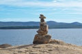 Pile of stones stacked by the lake. Royalty Free Stock Photo