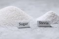 A pile of sugar and stevia sweetener with signatures Royalty Free Stock Photo