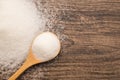 Pile of sugar on wooden plank background. Use for Diabetes check