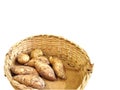 Pile of sweet potatoes in a basket isolated in white background Royalty Free Stock Photo