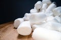 Pile of sweet and soft marshmallow. Yummy white sweets on dark background, fast food