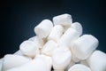 Pile of sweet and soft marshmallow. Yummy white sweets on dark background, fast food