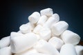 Pile of sweet and soft marshmallow. Yummy white sweets on dark background, fast food