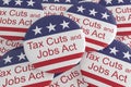 Pile of Tax Cuts And Jobs Act Buttons With US Flag, 3d illustration