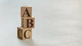 Pile with three wooden cubes - letters ABC on them, space for more text / images on right side Royalty Free Stock Photo