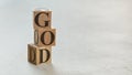 Pile with three wooden cubes - letters GOD on them, space for more text / images on right side Royalty Free Stock Photo