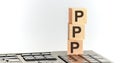 Pile with three wooden cubes - letters PPP meaning Praise Picture Push on them, space for more text - images at right side. The