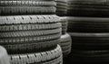 Pile of tires stack in warehouse waiting to transport to distributors, new car tyres product in manufacturing factory background Royalty Free Stock Photo