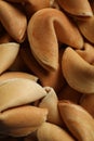 Pile of traditional fortune cookies as background, closeup