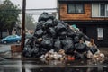 pile of trash bags surrounding an overfilled dumpster Royalty Free Stock Photo