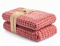 Pile of Two Pink Knitted Washcloths Tied with Beige String on White Background Royalty Free Stock Photo