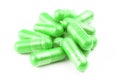 Pile of ufo green organic capsules on white background closeup with selective focus Royalty Free Stock Photo