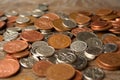 A pile of Uk sterling currency coins.