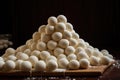 pile of uncooked dough balls ready to be baked