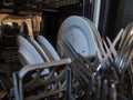 Pile of unwashed, dirty dishes in the sink. Mess in the kitchen. Dirty kitchenware, plates and mugs. Chaos at home Royalty Free Stock Photo