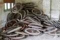 Pile of used bicycle wheels in an abandoned garbage dump