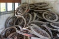 Pile of used bicycle wheels in an abandoned garbage dump