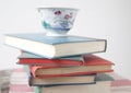 Pile of used books with teacup Royalty Free Stock Photo