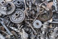 pile of used car transmission gears, full-frame close view background