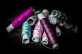 Pile of used colorful spools of thread tailoring Royalty Free Stock Photo