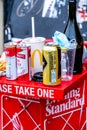 Pile Of Used Empty Cans Bottles And Food Left On Newspaper Stand Waterloo Station London