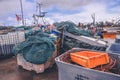 Pile of used fishing and nautical equipment on a ship on a dock Royalty Free Stock Photo