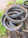 a pile of used motorbike tires that are not suitable for use