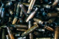 Pile of used rifle cartridges 7.62 mm caliber, many empty bullet shells, assault rifle bullet shell, military background, top view