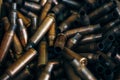 Pile of used rifle cartridges 7.62 mm caliber, many empty bullet shells, assault rifle bullet shell, military background, top view