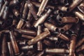 Pile of used rifle cartridges 7.62 mm caliber, many empty bullet shells, assault rifle bullet shell, military background, top view