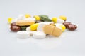 Pile of various colorful pills isolated on white Royalty Free Stock Photo