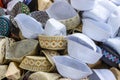 A pile of various designed taqiyah cap or muslim prayer cap