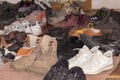 Pile of the various old worn footwear, selective focus Royalty Free Stock Photo