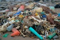 pile of various plastic debris washed up on shore Royalty Free Stock Photo
