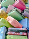 Pile of various styles of colourful suitcases