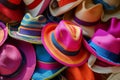 pile of vibrant beach hats ready for a shop window