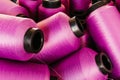 many pink threads are laid out and ready for sale on a pile