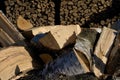 Pile and wall of cut birch wood and stacked wood logs