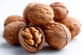 A pile of walnuts on a white surface Royalty Free Stock Photo
