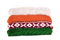 Stack of multicolored winter clothes isolated on white background Royalty Free Stock Photo