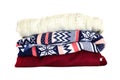 Stack of multicolored winter clothes isolated on white background Royalty Free Stock Photo