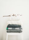 Pile of warm sweaters and blankets for autumn and winter Royalty Free Stock Photo