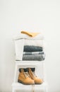 Pile of warm sweaters and blankets, cap and boots Royalty Free Stock Photo