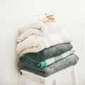 Pile of warm winter sweaters and blankets, square crop Royalty Free Stock Photo